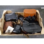 A box of cased Regent 10x50 field glasses, vintage cameras,