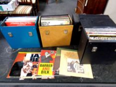 Four cases containing vinyl LPs to include Acker Bilk, jazz,