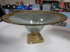 A contemporary glass bowl on stand