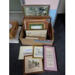 A box containing assorted framed pictures and prints including wool and needlework pictures,