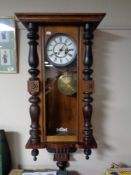 An early 20th century mahogany cased Vienna wall clock