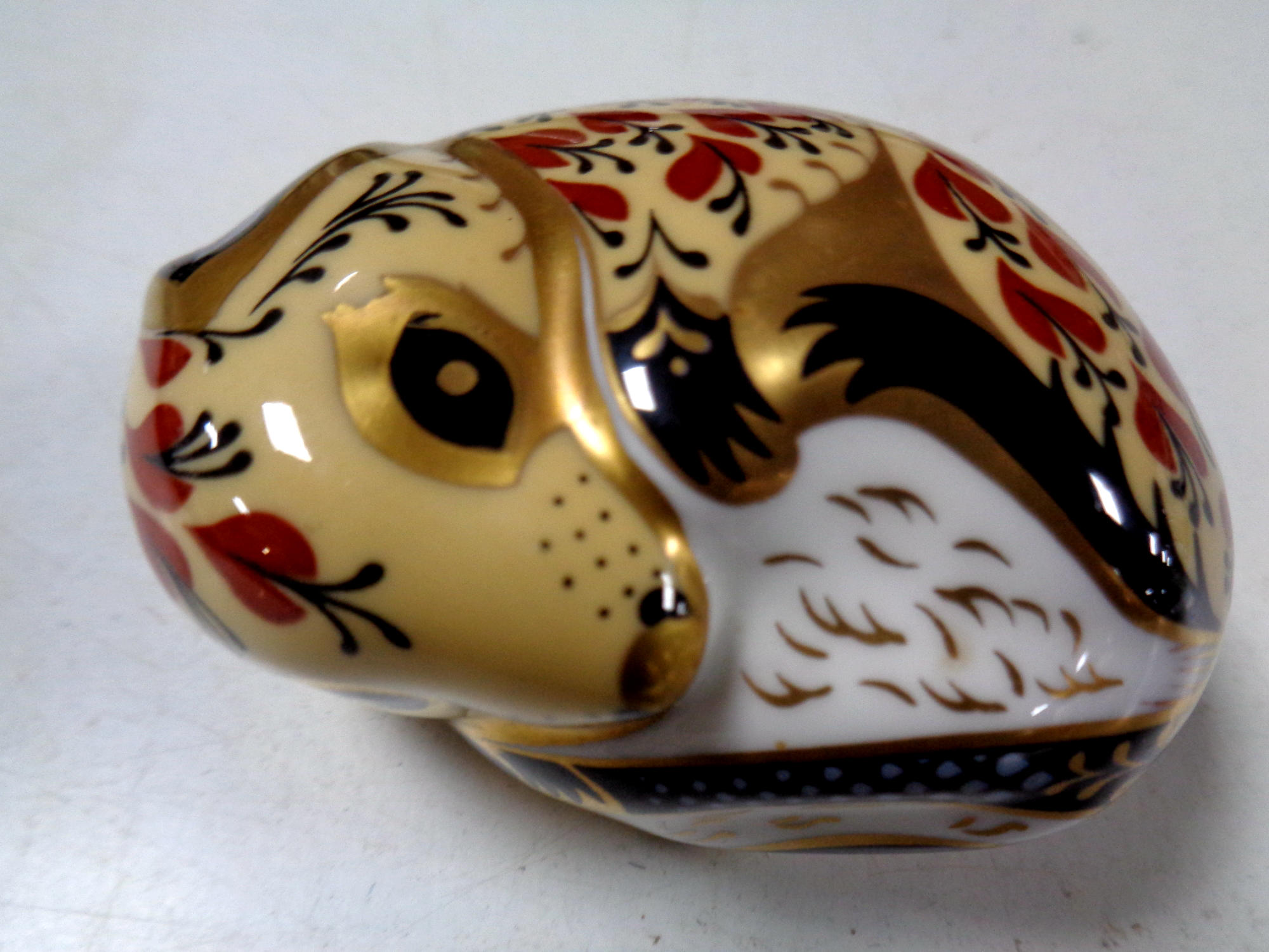 A Royal Crown Derby china paperweight with silver stopper,