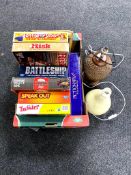 A box containing assorted board games to include Battleship, Risk,