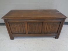 An oak linen fold blanket box