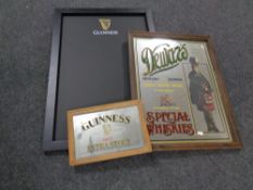 A pub chalk board bearing Guinness advertisement together with two further advertisement mirrors -