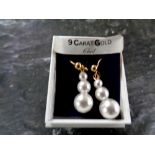 A pair of 9ct gold and pearl earrings