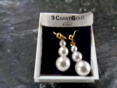 A pair of 9ct gold and pearl earrings