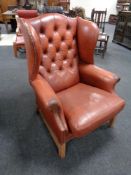 A 20th century Chesterfield wingback armchair