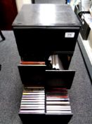 Two cases and three storage drawers containing assorted CDs and vinyl LPs