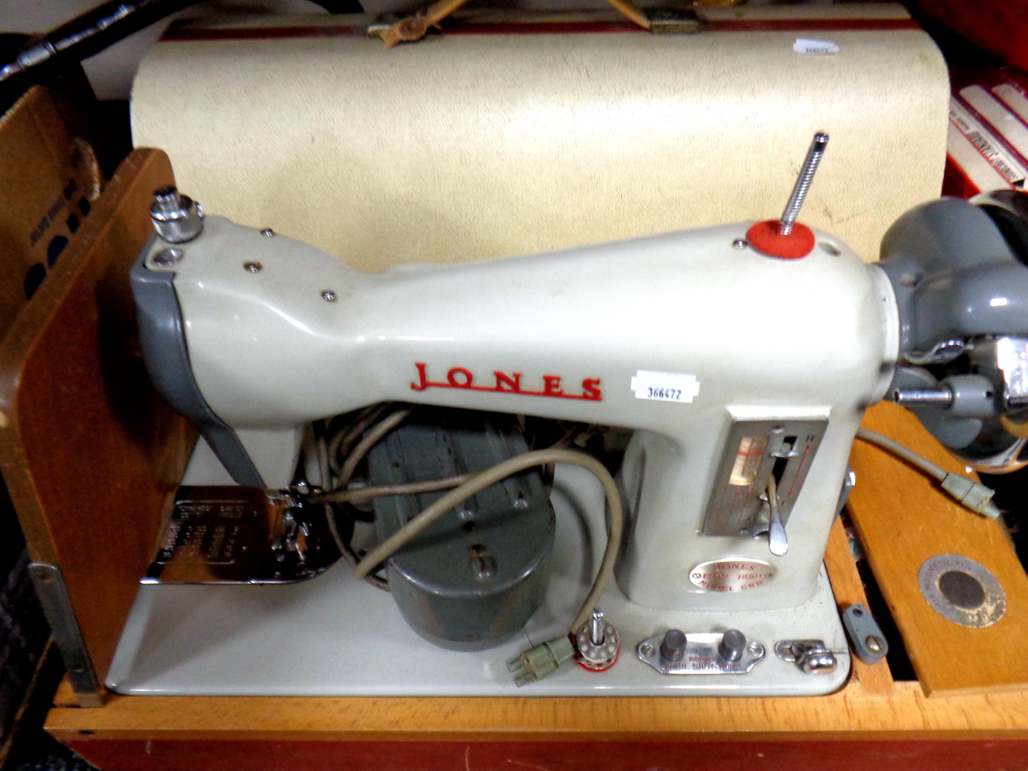 A cased 20th century Jones electric sewing machine