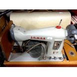 A cased 20th century Jones electric sewing machine