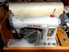 A cased 20th century Jones electric sewing machine