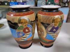 A pair of Japanese Satsuma vases, height 24.