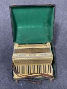 A Hohner Tango IV piano accordion in case