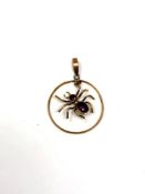 A vintage 9ct spider pendant