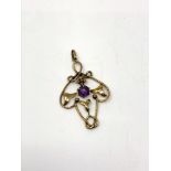 A 9ct gold pendant set with amethyst