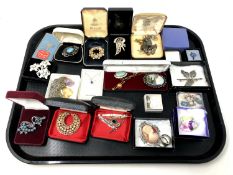 A tray of costume and silver jewellery.