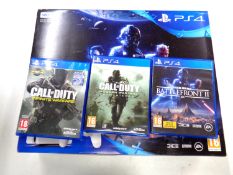 A boxed Sony PS4 500GB together with three games CONDITION REPORT: This has been