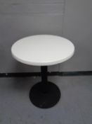 Six circular cafe tables on pedestals