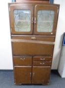 A mid 20th century kitchen cabinet