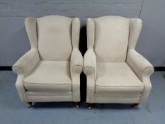 A pair of Marks & Spencer Victorian style wing back armchairs in beige fabric