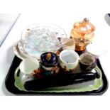 A tray containing miscellaneous to include an antique glass rolling pin, commemorative mugs, plates,