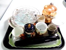 A tray containing miscellaneous to include an antique glass rolling pin, commemorative mugs, plates,