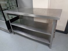 A stainless steel three tier prep table,