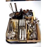 A tray containing a large quantity of plated and stainless steel cutlery together with other metal