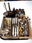 A tray containing a large quantity of plated and stainless steel cutlery together with other metal