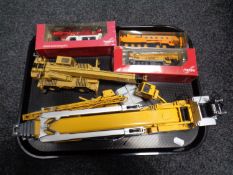 A tray containing boxed and unboxed die cast and plastic cranes to include Grove RT865B,