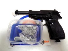 A 338 Auto gas powered air pistol with pellets