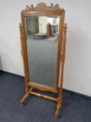 A Victorian stained beech cheval mirror