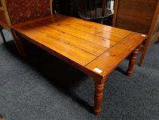 A contemporary pine rectangular coffee table