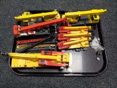 A tray containing unboxed die cast cranes to include Grove,