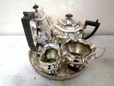 A four piece plated tea service on circular tray