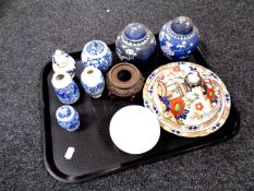 A tray containing oriental wares to include blue and white ginger jars, vases, carved wooden stand,