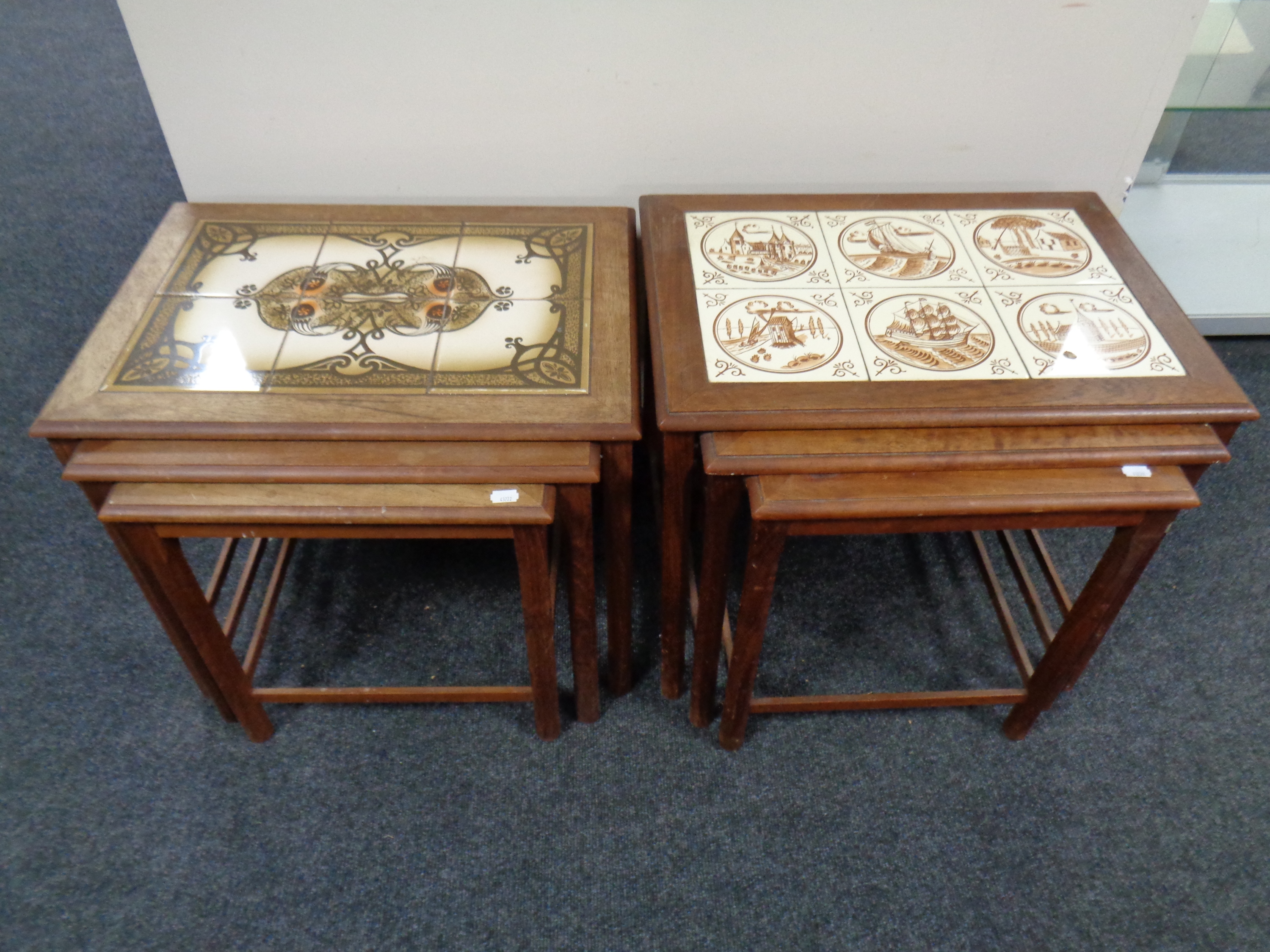 Two nests of three continental teak tile topped tables