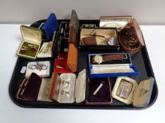 A tray containing costume jewellery, cuff links, boxed Ronson Varaflame lighter,