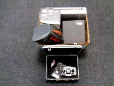 A box containing Samsung DVD VCR recorder, cased Kodak projector, a Yamaha guitar amplifier,