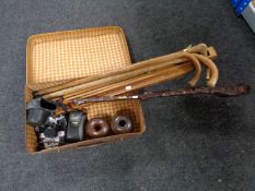 A vintage leather case containing walking sticks, folding easel,
