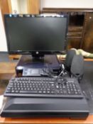A HP monitor together with an Epsom scanner and printer,