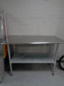 A stainless steel two tier prep table,