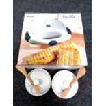 A boxed Ideline sandwich toaster together with two Wilkin and Sons cheese bakers with knife