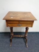 A Victorian walnut work table