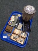 A tray containing miscellaneous to include cased vintage spectacles, Ringtons Cathedral tin,