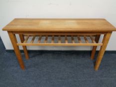 A contemporary oak side table with under shelf