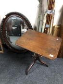 A Victorian mahogany pedestal occasional table together with an oval framed mirror (a/f)