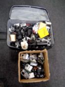 A suitcase and a box containing a large quantity of assorted cameras to include Casio, Canon,