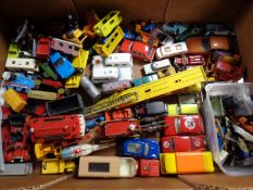 A box containing a quantity of mid 20th century and later play worn die cast vehicles to include